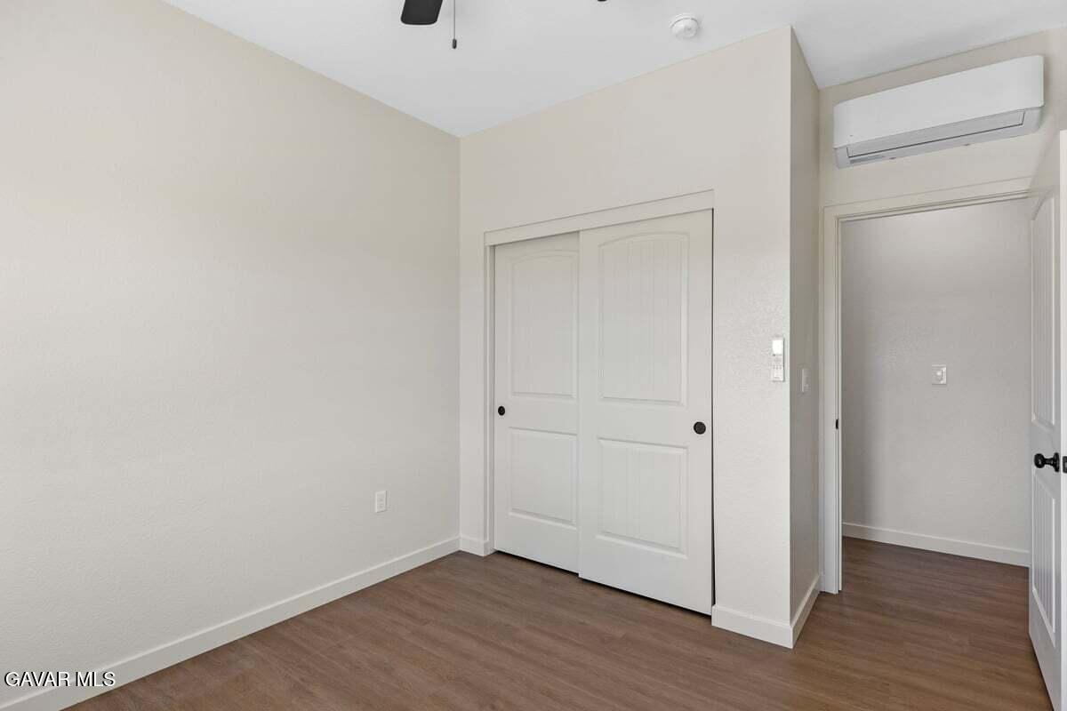 10654 Wilson Road California City, CA 93505 - Photo 24 of 36 a view of an empty room with wooden floor