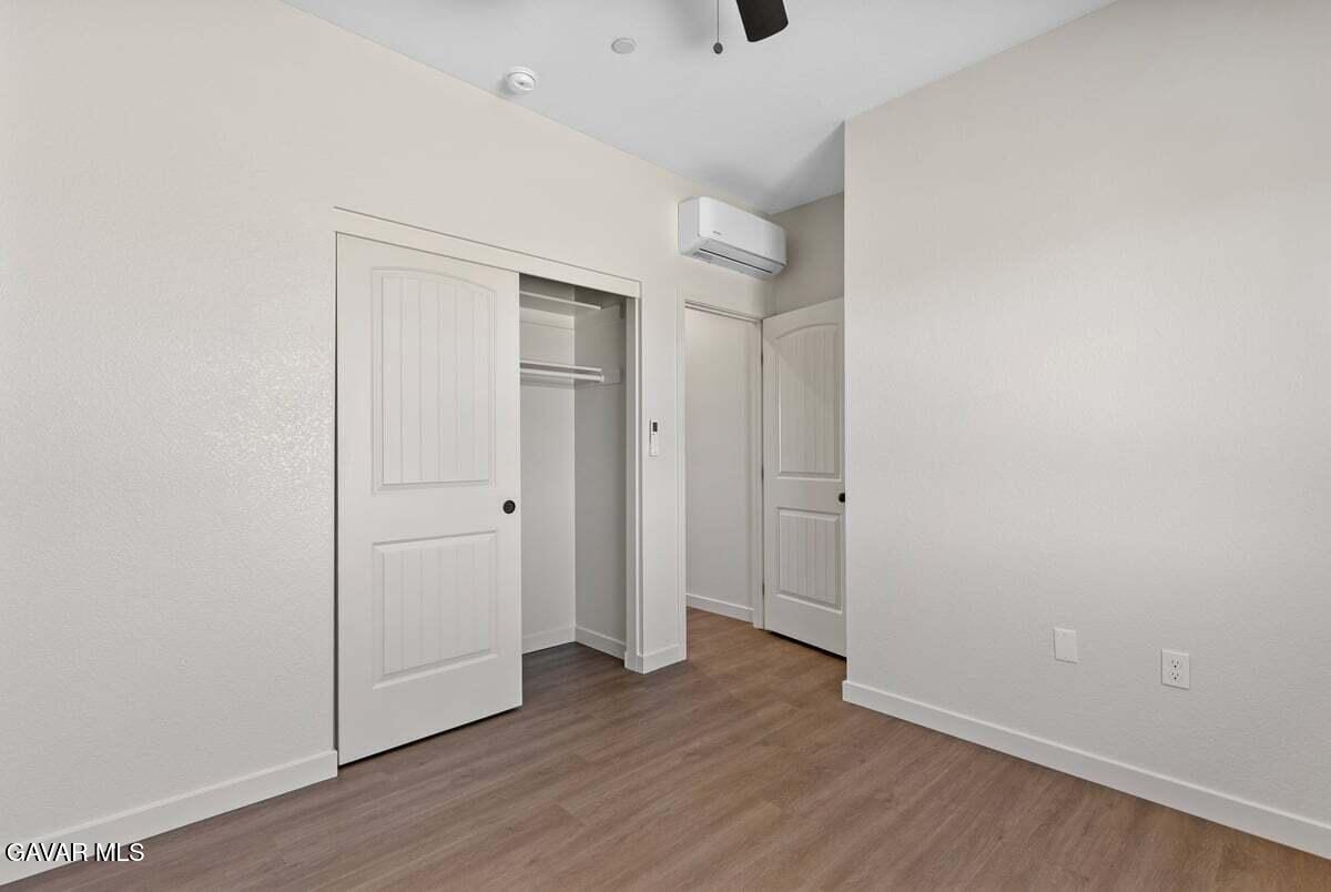 10654 Wilson Road California City, CA 93505 - Photo 25 of 36 a view of a hallway with wooden floor