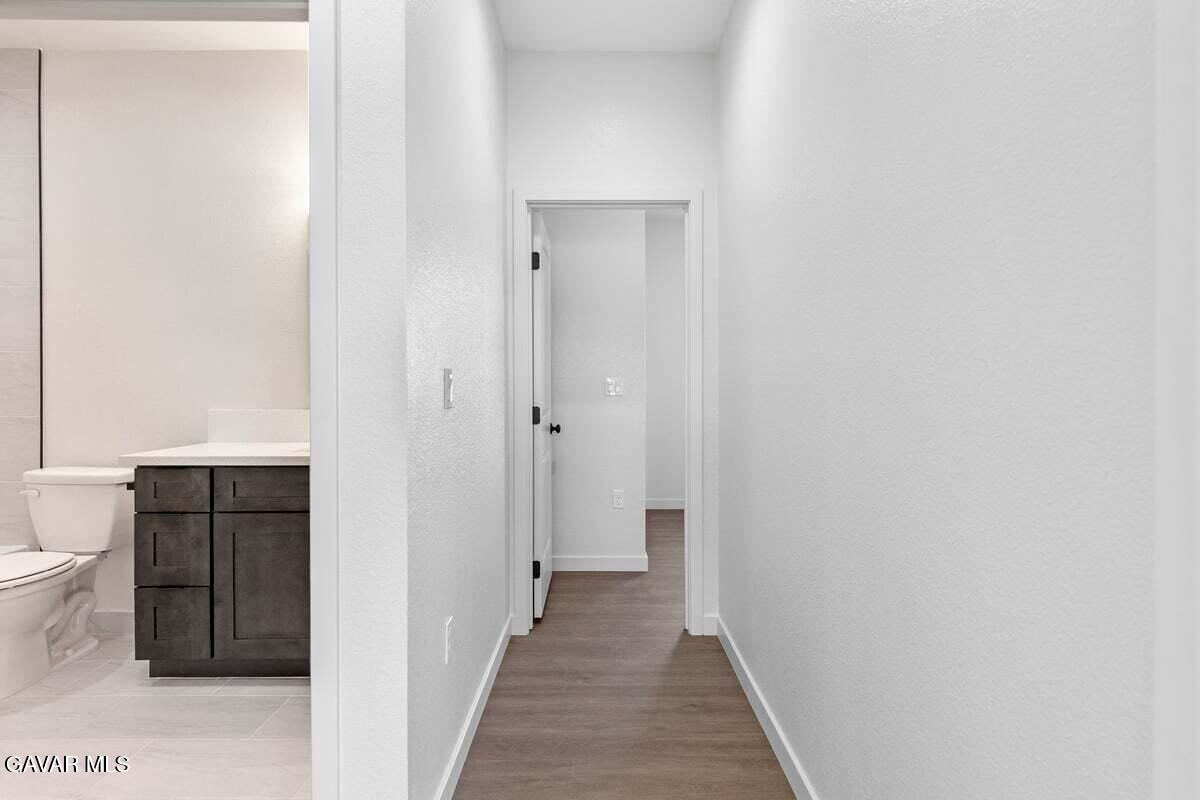 10654 Wilson Road California City, CA 93505 - Photo 26 of 36 a view of a bathroom from the hallway