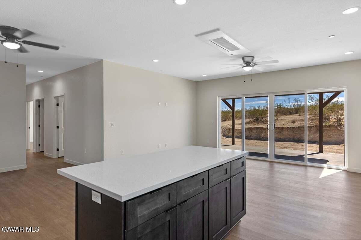 10654 Wilson Road California City, CA 93505 - Photo 9 of 36 a kitchen with a sink a counter top space and a view of kitchen