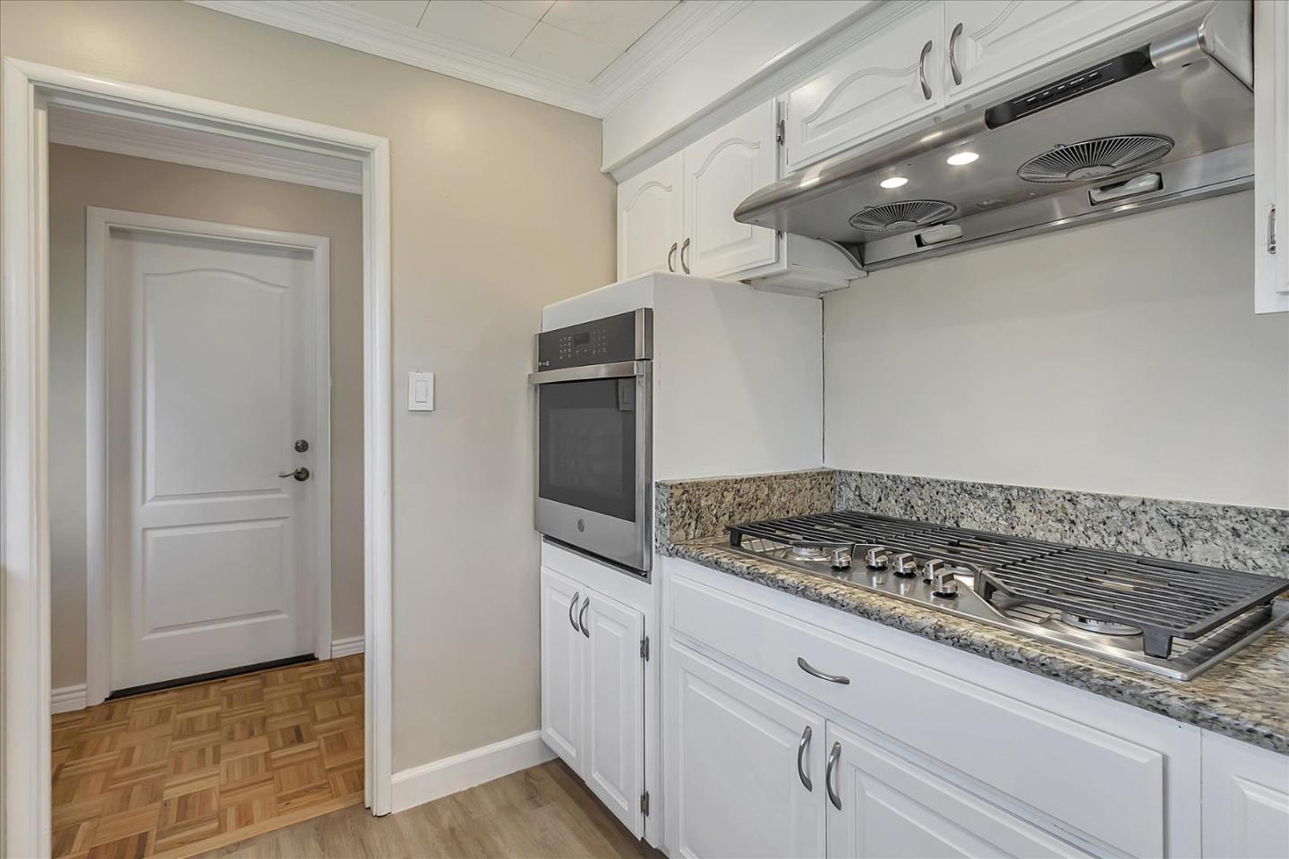 1963 Geneva Street San Jose, CA 95124 - Photo 11 of 35 a kitchen with white cabinets and appliances