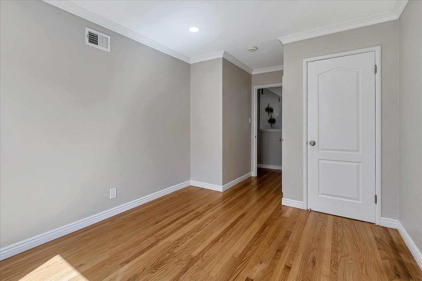 1963 Geneva Street San Jose, CA 95124 - Photo 15 of 35 a view of an empty room with wooden floor