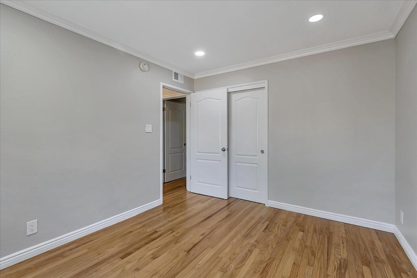1963 Geneva Street San Jose, CA 95124 - Photo 16 of 35 a view of an empty room with wooden floor