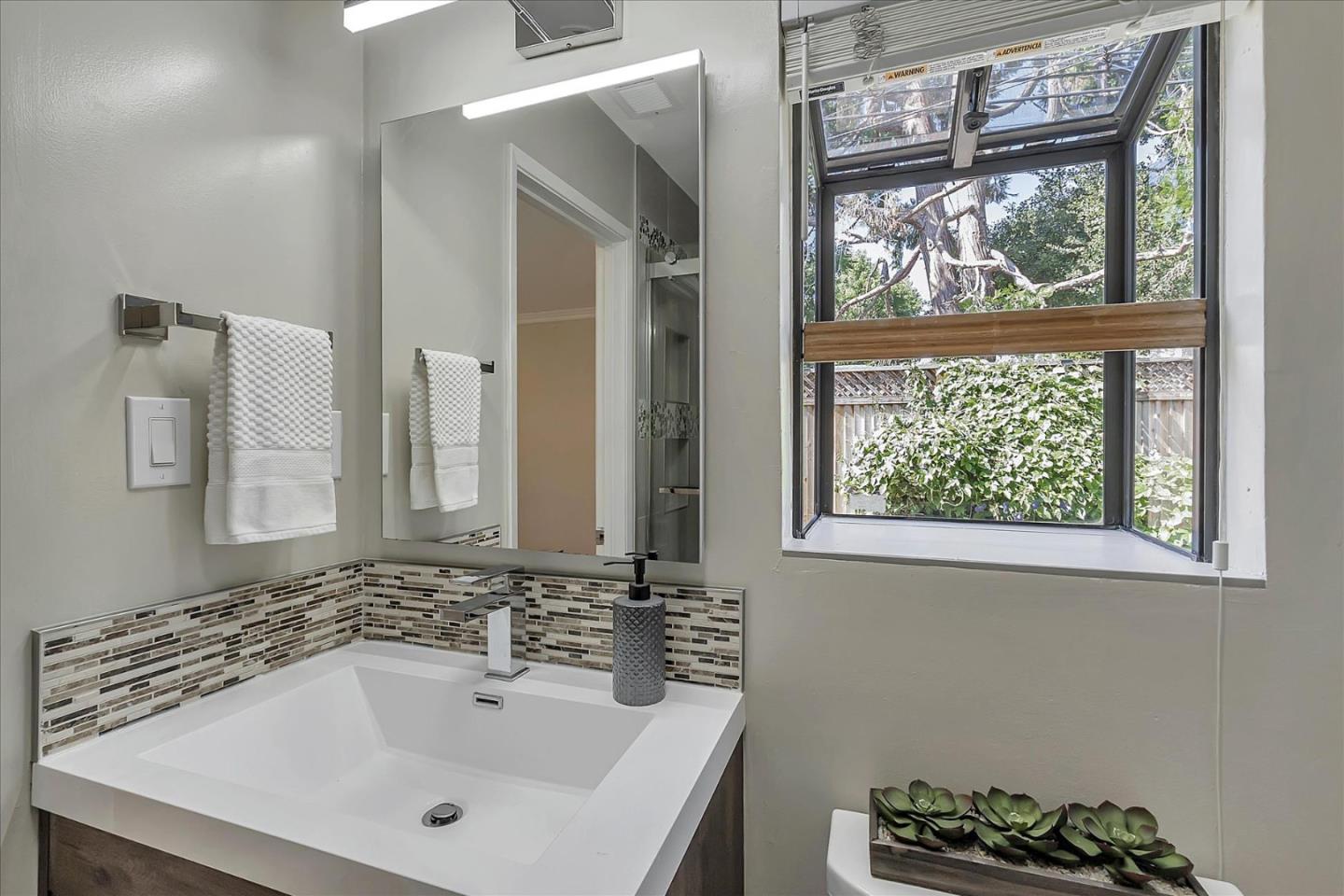 1963 Geneva Street San Jose, CA 95124 - Photo 19 of 35 a bathroom with a sink and a window
