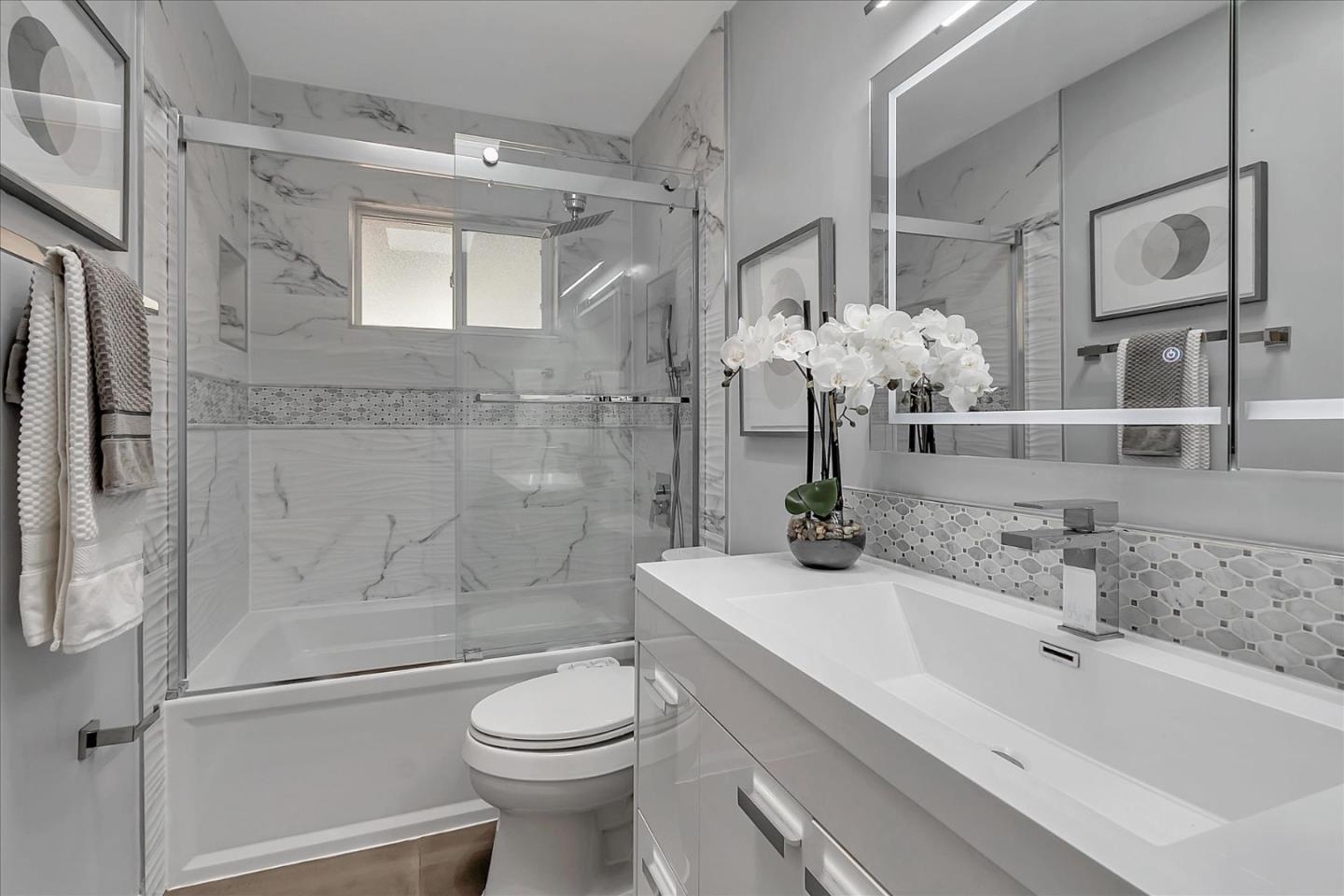 1963 Geneva Street San Jose, CA 95124 - Photo 20 of 35 a bathroom with a sink a toilet and shower