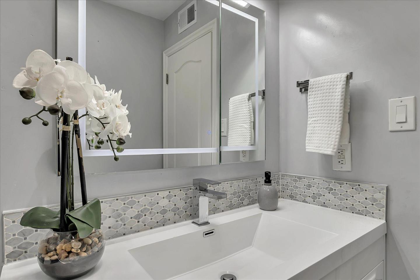 1963 Geneva Street San Jose, CA 95124 - Photo 21 of 35 a bathroom with a sink a potted plant and a window