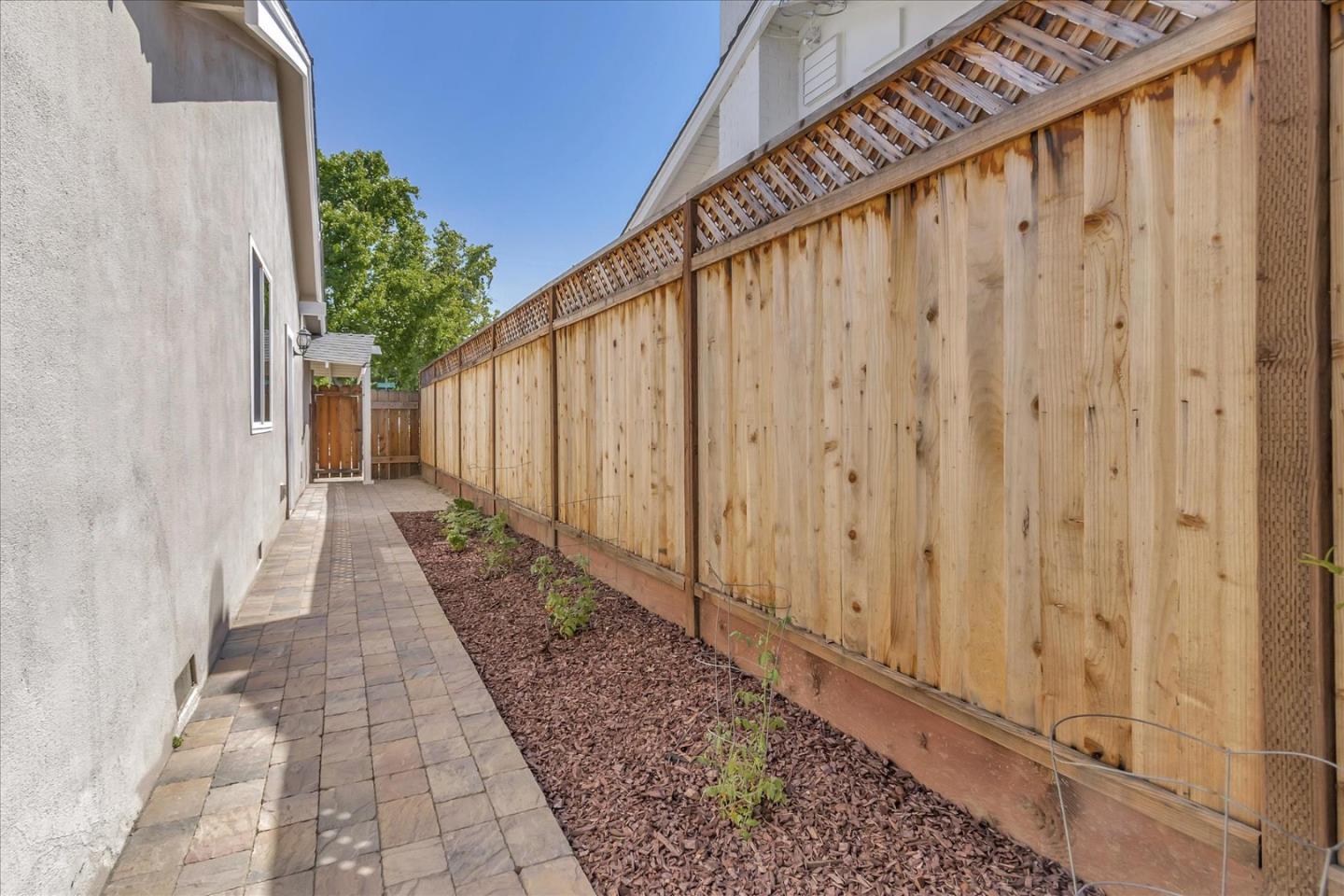 1963 Geneva Street San Jose, CA 95124 - Photo 27 of 35 a view of a pathway with a wooden fence