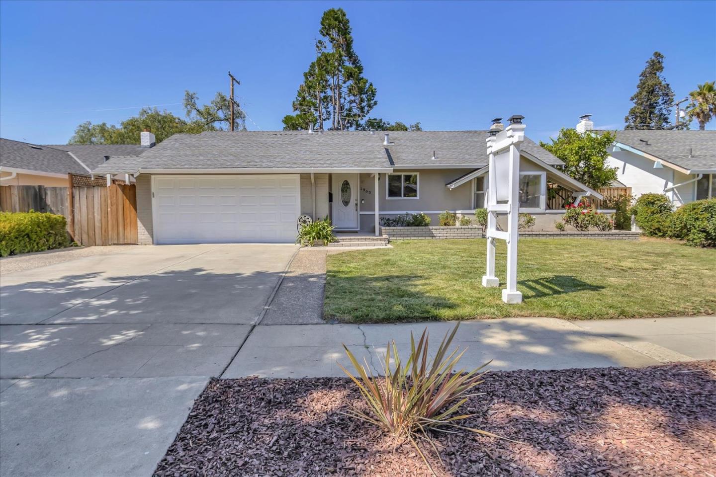 1963 Geneva Street San Jose, CA 95124 - Photo 3 of 35 a front view of a house with garden