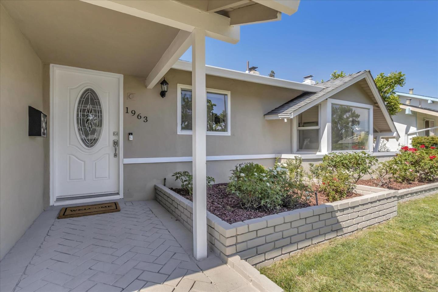 1963 Geneva Street San Jose, CA 95124 - Photo 5 of 35 a front view of a house with garden