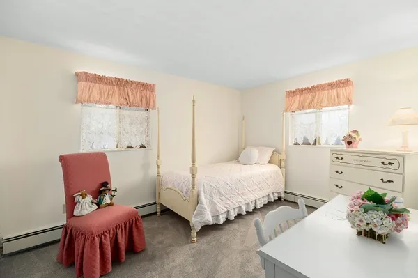 a bedroom with bed and a couch