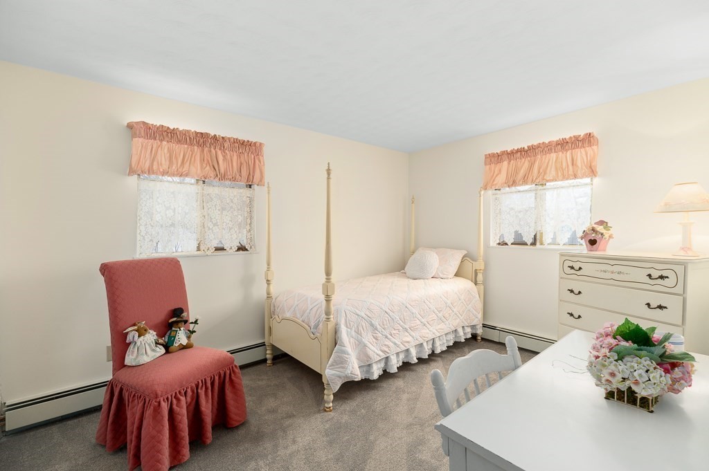 14 Grove Street Danvers, MA 01923 - Photo 11 of 23 a bedroom with bed and a couch
