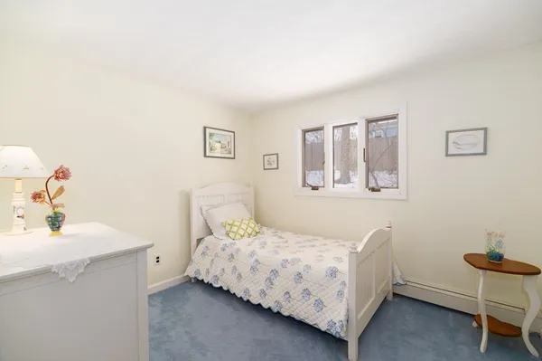 a bedroom with a bed and a table in it