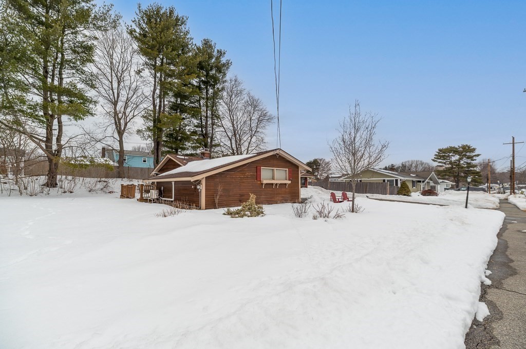 14 Grove Street Danvers, MA 01923 - Photo 20 of 23 a tall white house with a outdoor space