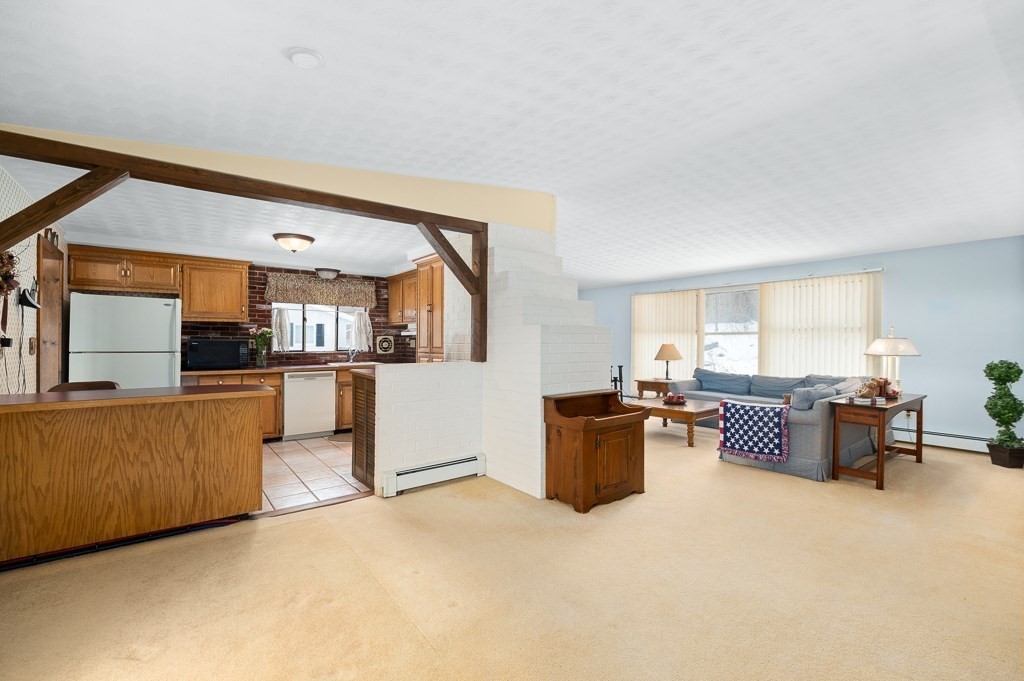 14 Grove Street Danvers, MA 01923 - Photo 2 of 23 a living room with furniture and kitchen