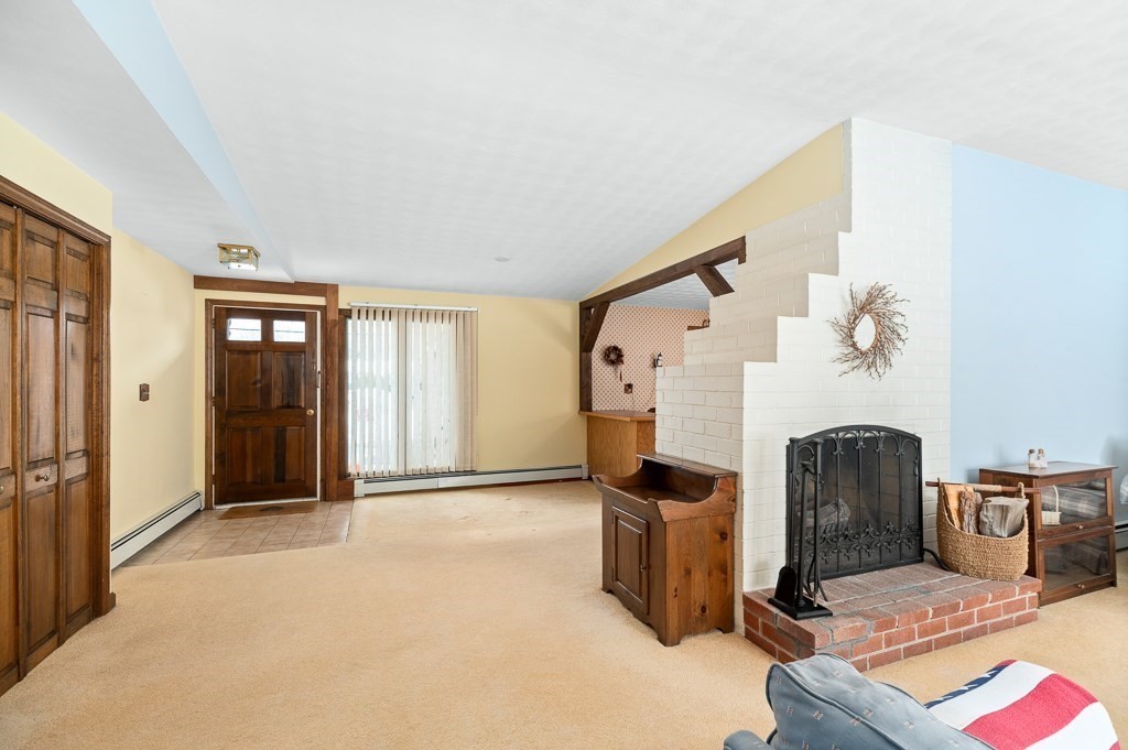 14 Grove Street Danvers, MA 01923 - Photo 4 of 23 a view of a livingroom with a fireplace and cabinet