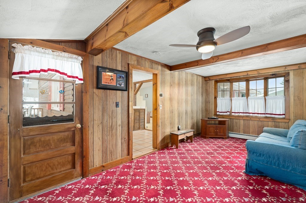 14 Grove Street Danvers, MA 01923 - Photo 10 of 23 a bedroom with a bed and a couch