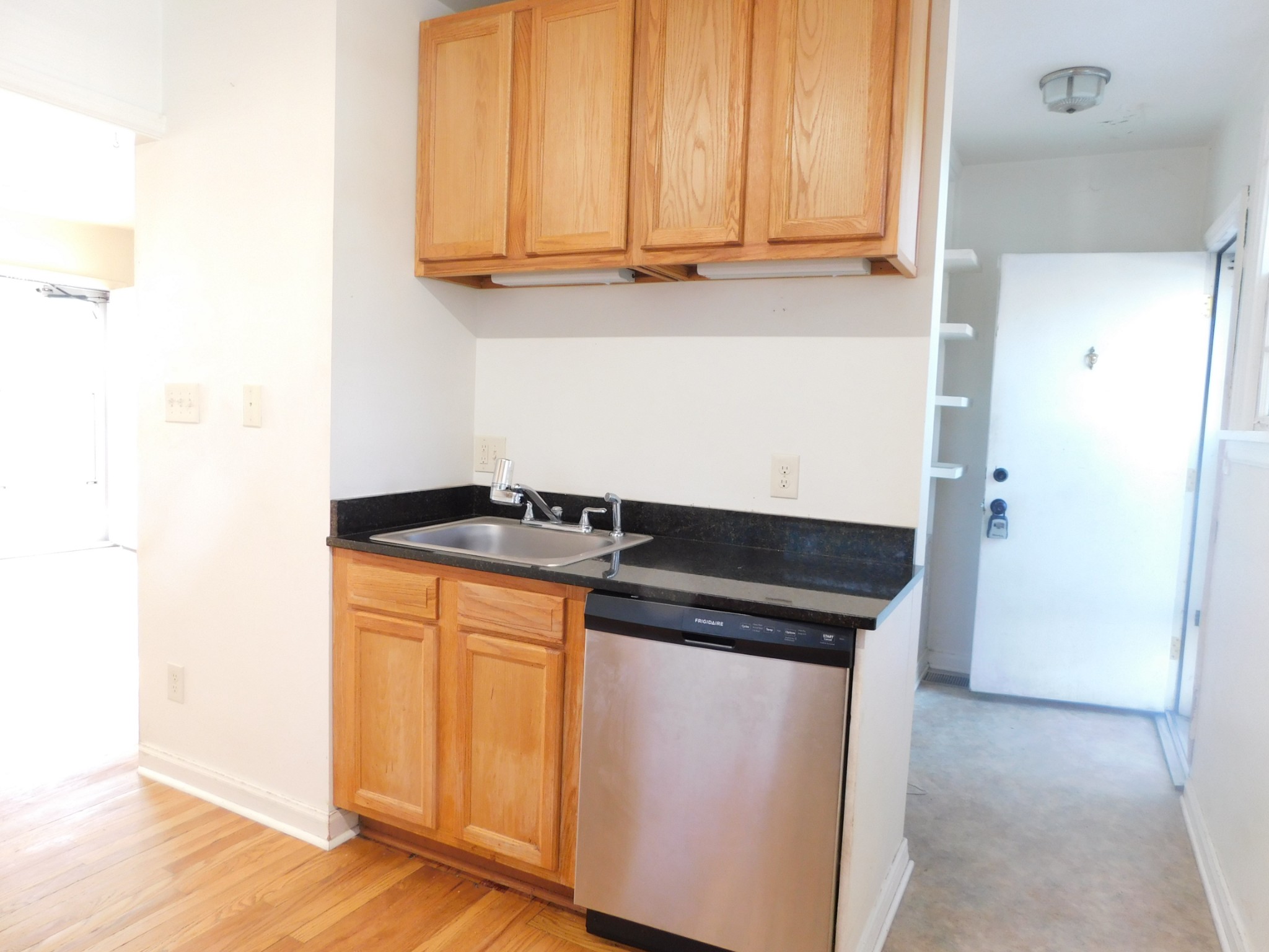 2801 Surrey Road Nashville, TN 37214 - Photo 28 of 43 a kitchen with granite countertop cabinets and black appliances