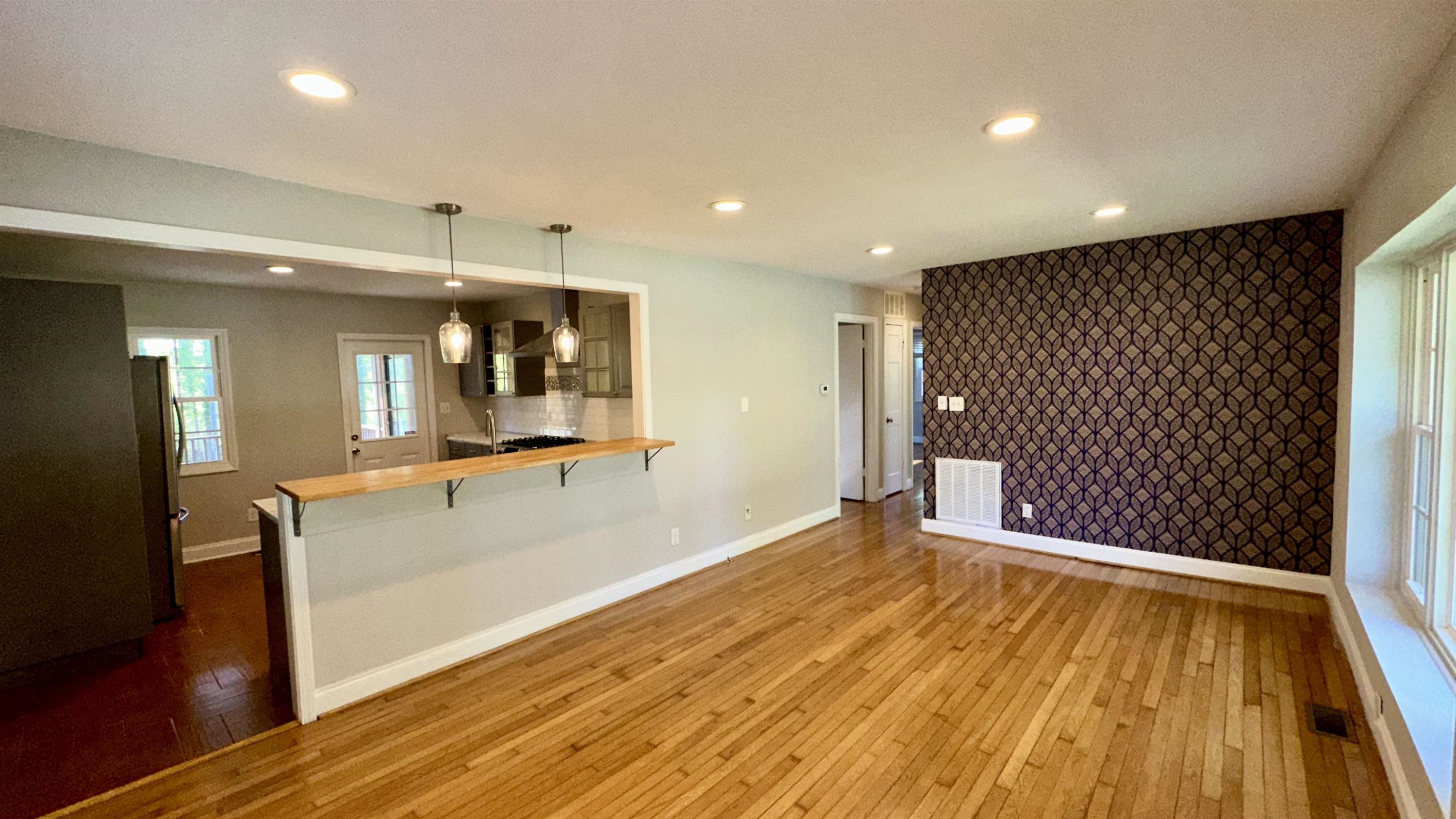1113 Marlborough Road Raleigh, NC 27610 - Photo 2 of 28 a view of a room with wooden floor and staircase