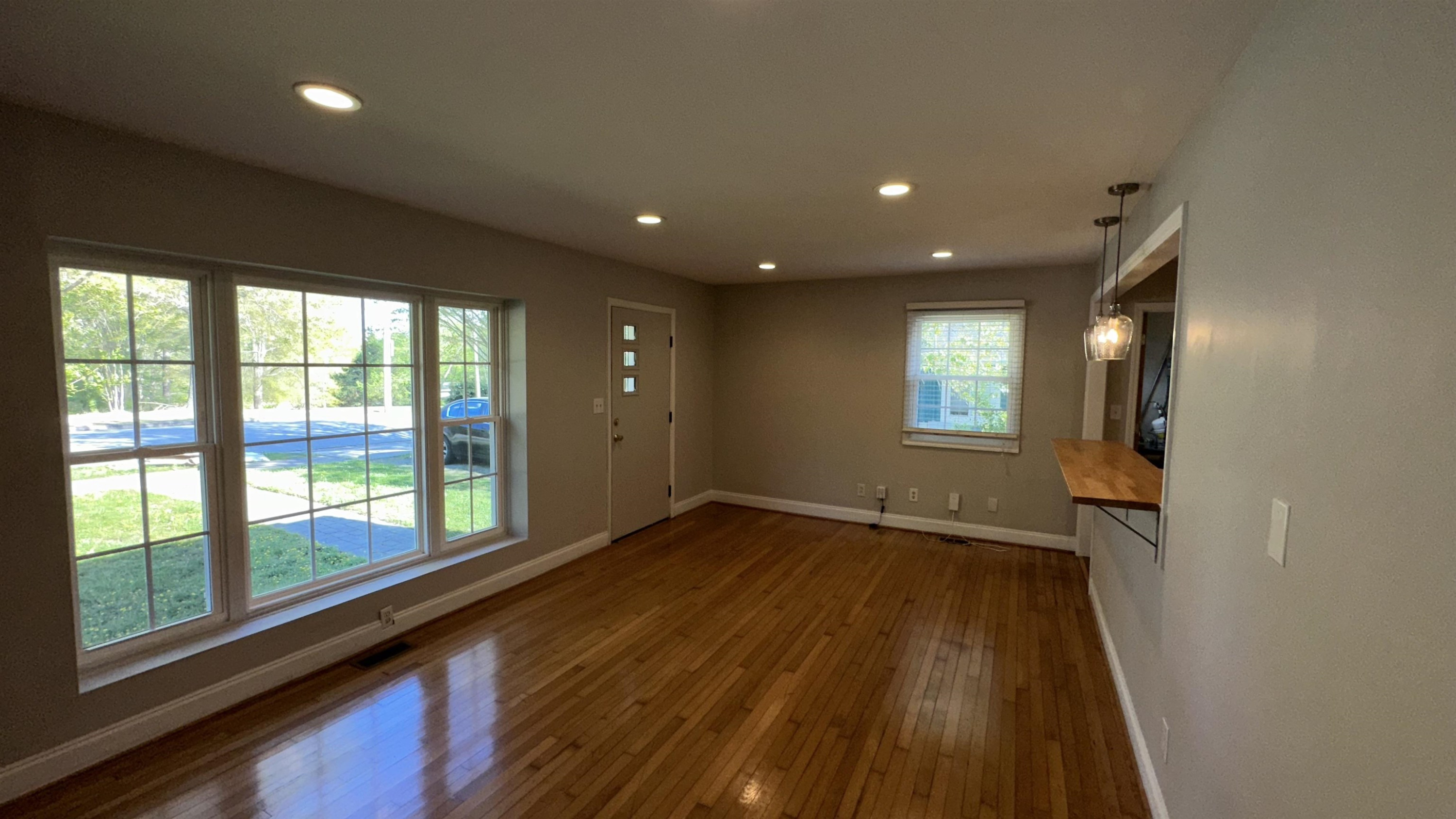 1113 Marlborough Road Raleigh, NC 27610 - Photo 22 of 28 a view of empty room with wooden floor and fan