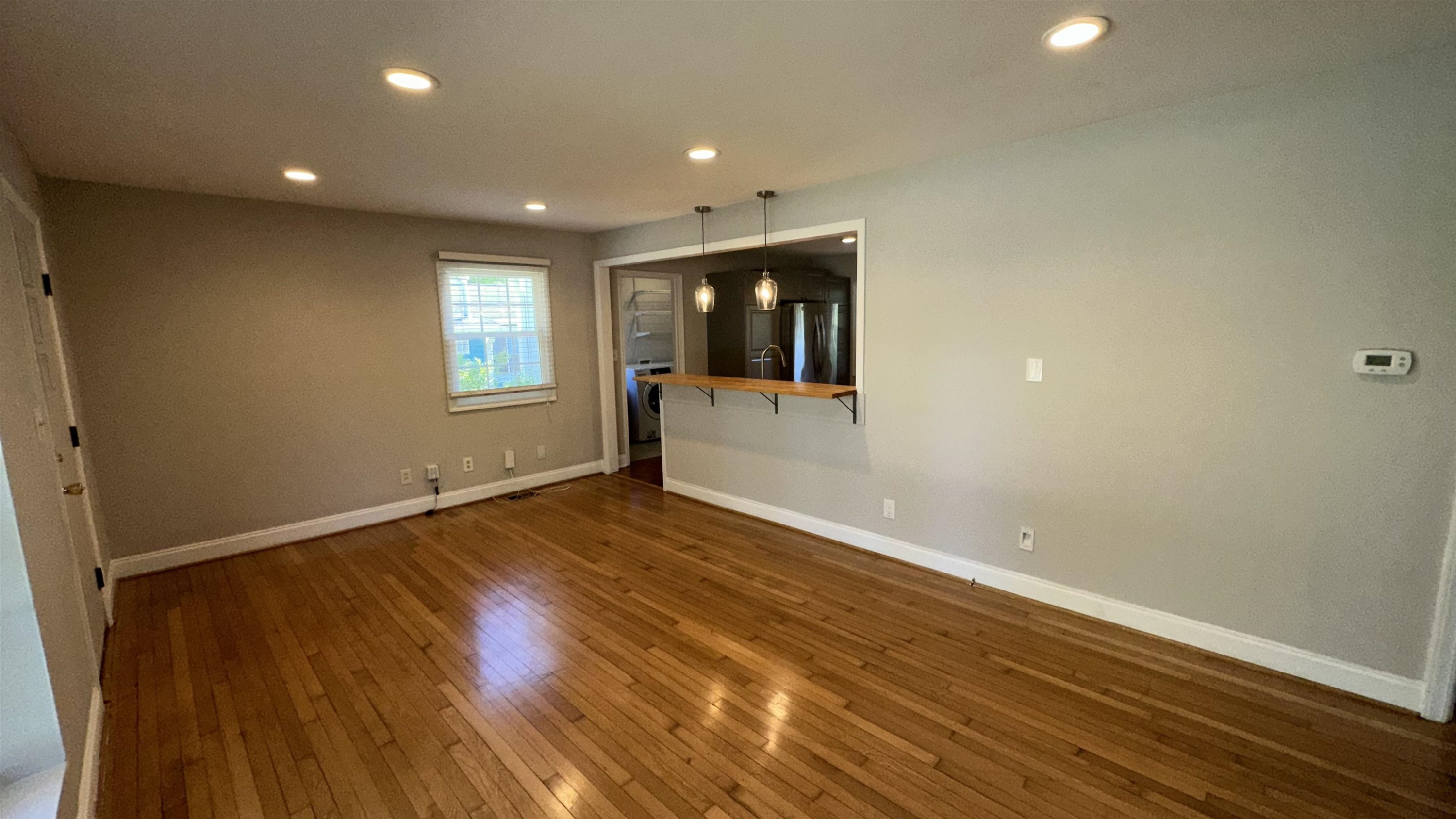 1113 Marlborough Road Raleigh, NC 27610 - Photo 23 of 28 an empty room with wooden floor and window