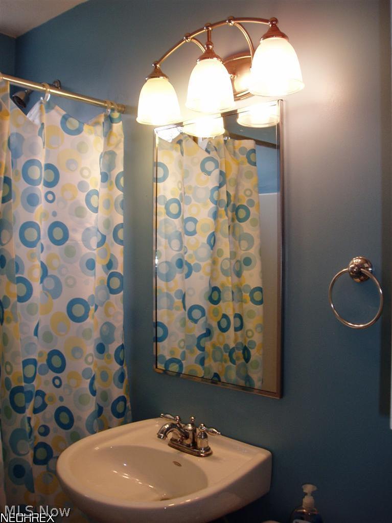 1800 Clyde Road Madison, OH 44057 - Photo 11 of 25 Both bathrooms have been completely updated. This is the first floor bath.