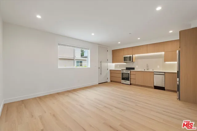 a view of a kitchen with a sink cabinets and window