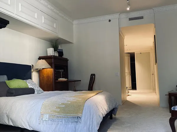 a bedroom with a bed and window