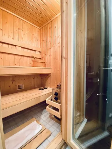 a bathroom with a bathtub and shower