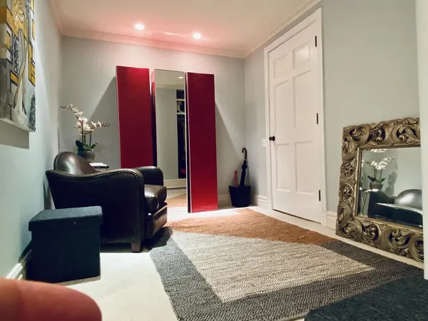 a living room with furniture pool and a flat screen tv