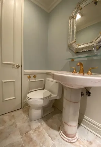 a bathroom with a toilet and a sink