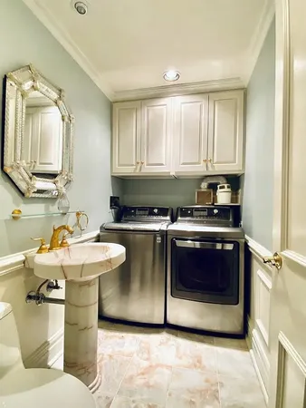 a kitchen with a stove a sink and a microwave