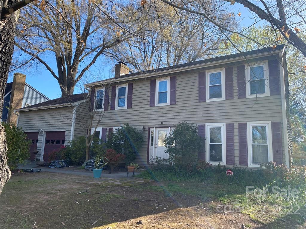 9907 Fairway Ridge Road Charlotte, NC 28277 - Photo 1 of 37 a front view of a house with garden