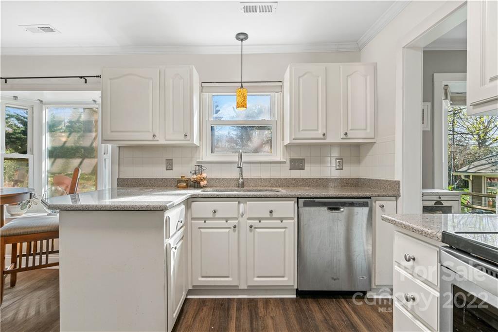 9907 Fairway Ridge Road Charlotte, NC 28277 - Photo 11 of 37 a kitchen with white cabinets and white appliances
