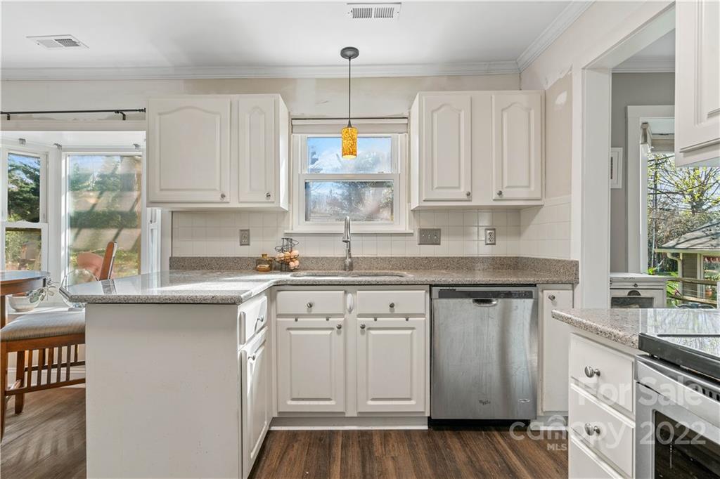 9907 Fairway Ridge Road Charlotte, NC 28277 - Photo 14 of 37 a kitchen with white cabinets and white appliances