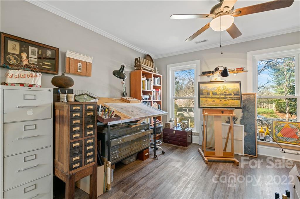 9907 Fairway Ridge Road Charlotte, NC 28277 - Photo 17 of 37 a bedroom with furniture a flat screen tv and a window