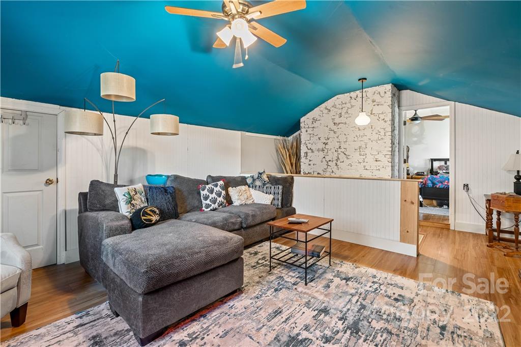 9907 Fairway Ridge Road Charlotte, NC 28277 - Photo 20 of 37 a living room with furniture and a wooden floor