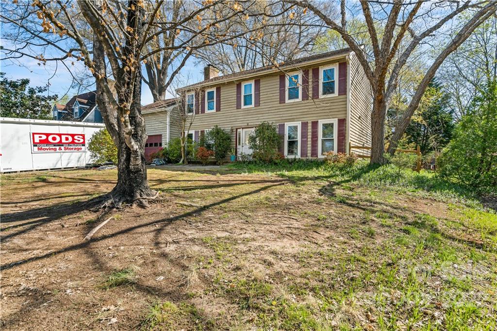 9907 Fairway Ridge Road Charlotte, NC 28277 - Photo 2 of 37 a front view of a house with a yard and trees