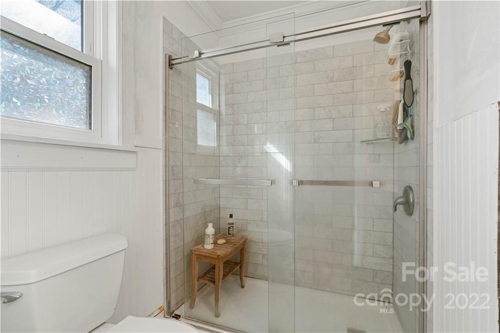 9907 Fairway Ridge Road Charlotte, NC 28277 - Photo 21 of 37 a bathroom with a shower and a toilet