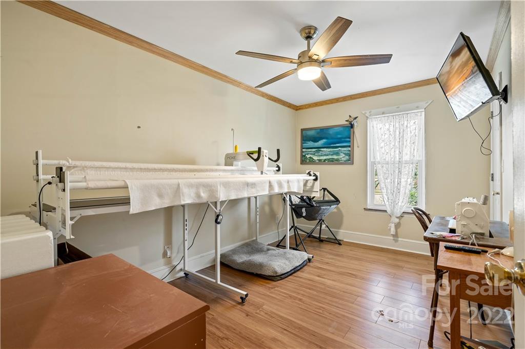 9907 Fairway Ridge Road Charlotte, NC 28277 - Photo 22 of 37 a room with furniture and a wooden floor