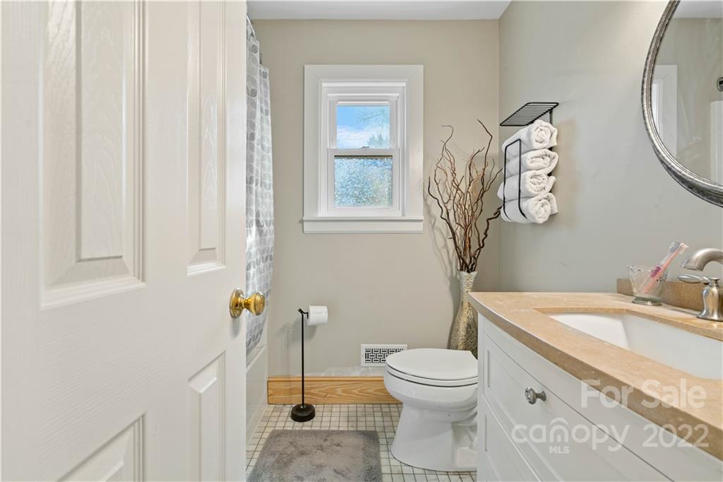 9907 Fairway Ridge Road Charlotte, NC 28277 - Photo 24 of 37 a bathroom with a toilet sink and mirror