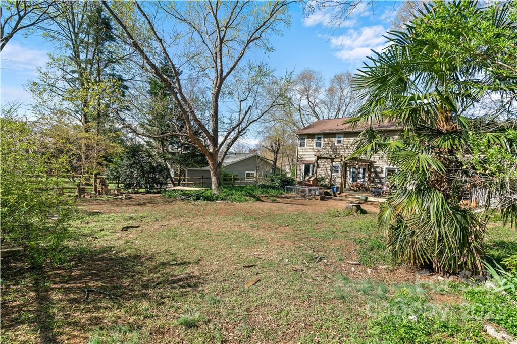 9907 Fairway Ridge Road Charlotte, NC 28277 - Photo 28 of 37 a view of a yard with plants and trees