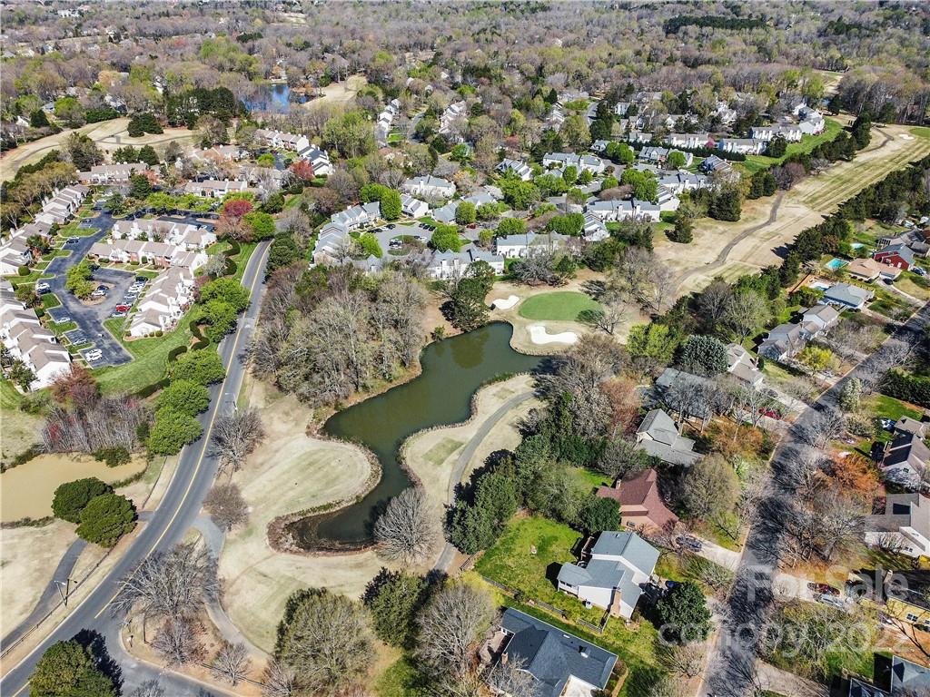 9907 Fairway Ridge Road Charlotte, NC 28277 - Photo 32 of 37 an aerial view of a house with a yard and lake view in back