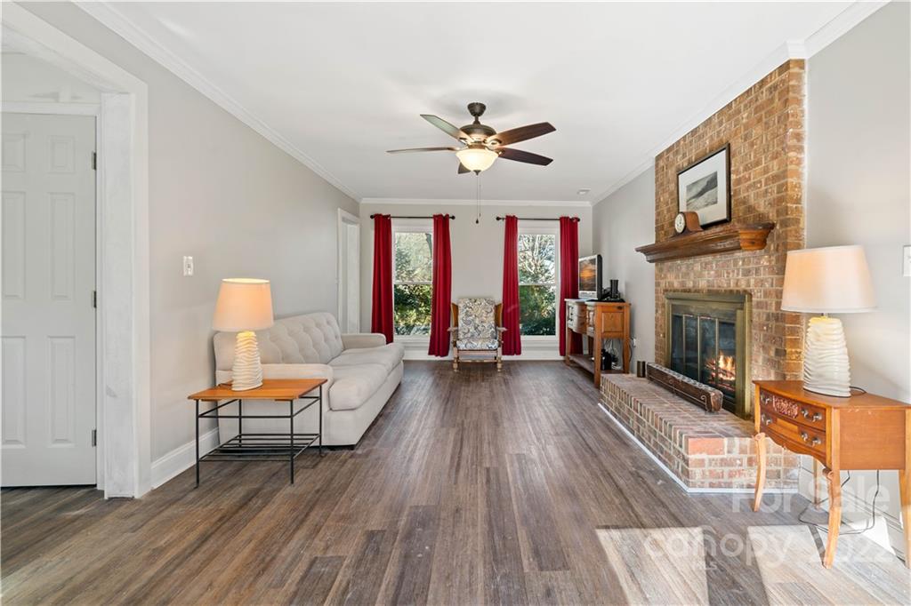 9907 Fairway Ridge Road Charlotte, NC 28277 - Photo 5 of 37 a living room with furniture and a fireplace