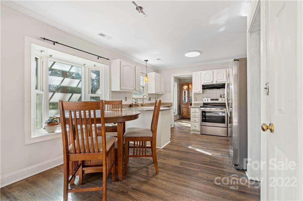 9907 Fairway Ridge Road Charlotte, NC 28277 - Photo 7 of 37 a dining room with furniture and window