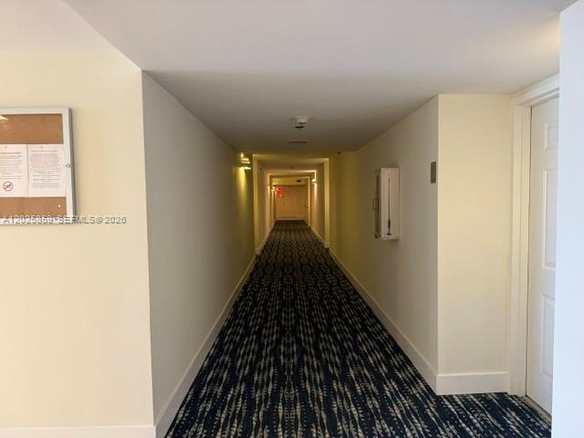 540 Brickell Key Drive, Unit 1024 Miami, FL 33131 - Photo 12 of 28 a view of a hallway with wooden floor and a bathroom