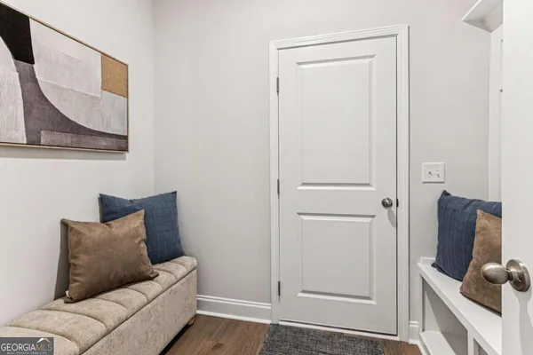 a living room with furniture and a gate