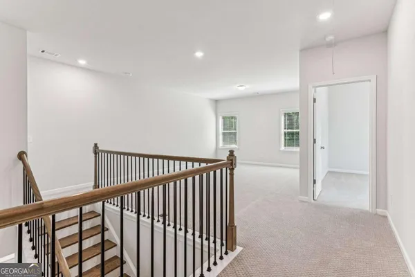 a view of a hallway with closet area