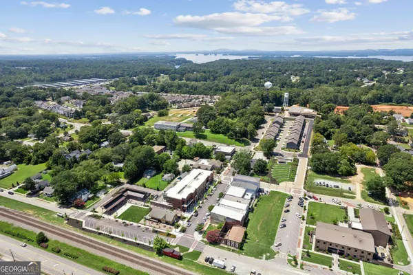 an aerial view of residential houses with outdoor space