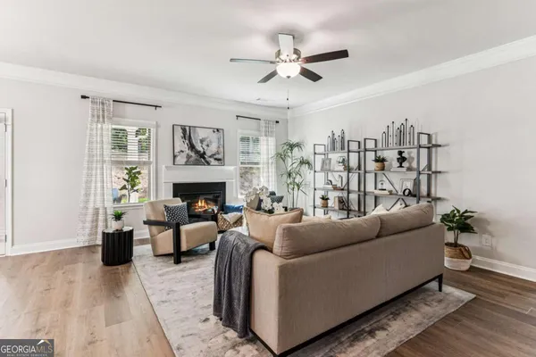 a living room with furniture and a fireplace