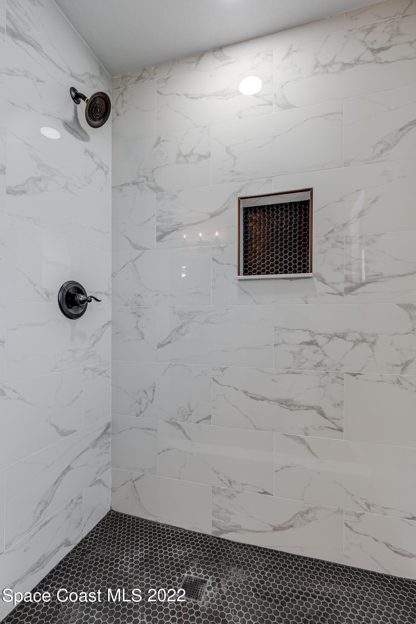 1011 Thompson Road Southwest Palm Bay, FL 32908 - Photo 12 of 17 a bathroom with a shower